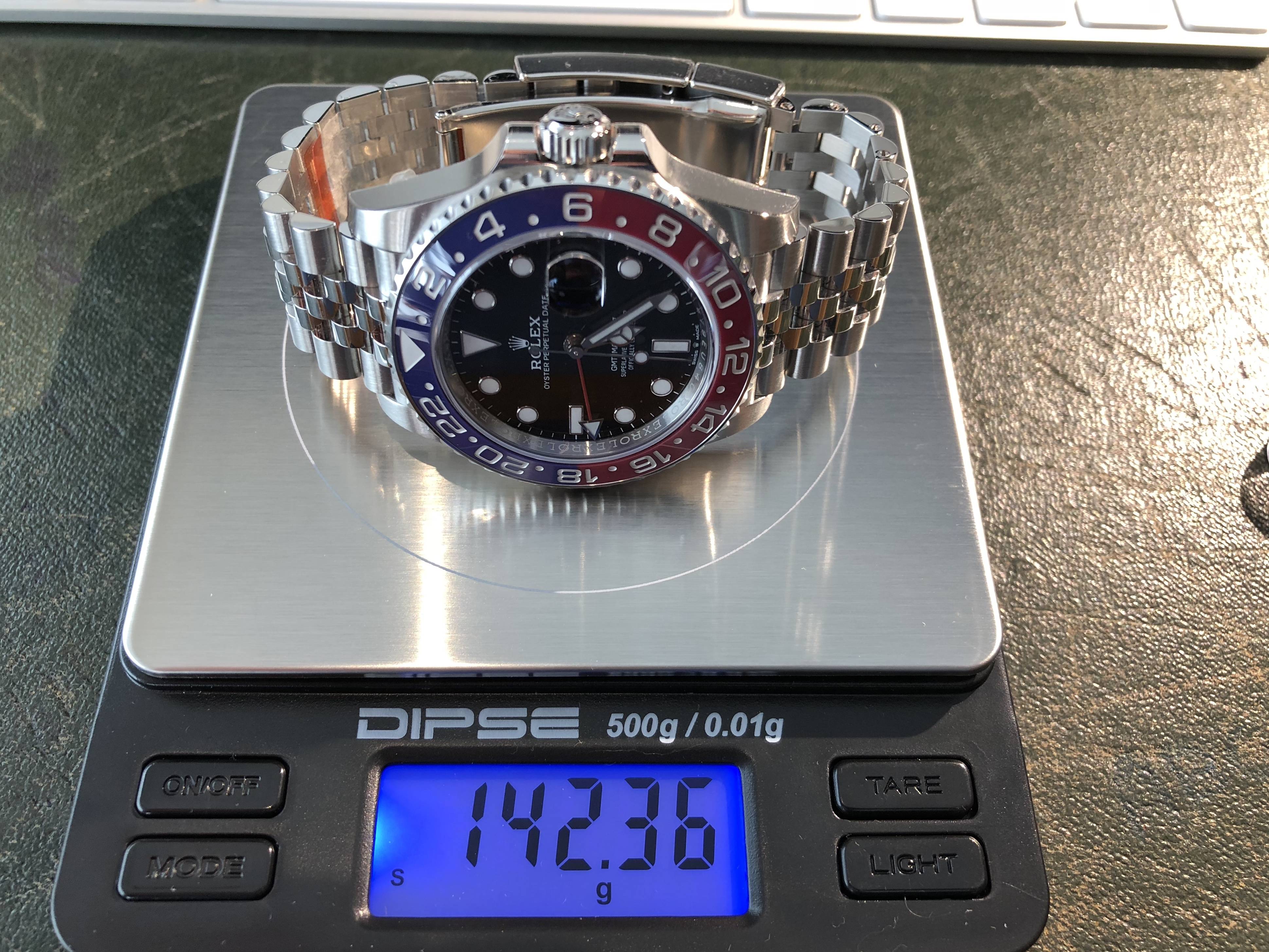 how much does a real rolex weigh